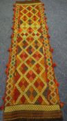 A Suzni Kilim runner, 286 x 75cms