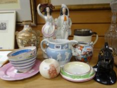 A parcel of mixed pottery including black lustre cow creamer, Staffordshire flat-back group, harvest