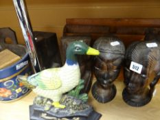 Four native African carved busts, a bargeware barrel with chess pieces as contents, letter rack