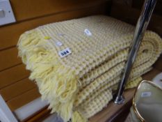A lemon coloured honeycomb blanket Condition Report: please request via email. Condition reports not