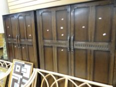 A gentleman's & ladies' linen-fold Priory or style wardrobes & a dressing table Condition Report: