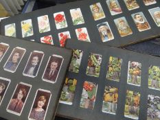 Four albums of vintage cigarette card sets including British Birds, Merchant Ships of the World, Ra