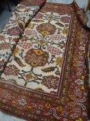 A Large mainly red persian type carpet