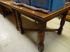 A vintage draw-leaf dining table Condition Report: please request via email. Condition reports not