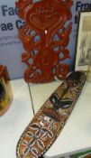 A Papua New Guinea painted wooden mask shield & another Papua New Guinea carved naturalistic