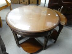 A reproduction circular and quartet coffee table nest having tooled leather inserts Condition