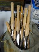 A carpenter's holdall with contents of wooden handled chisels Condition Report: please request via