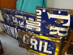An assortment of vintage enamel signs (distressed & cut)