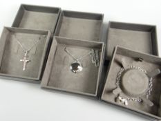 Three boxed Clogau gold jewellery items comprising Clogau Glyn Rhosyn Cross pendant (RRP £159), a
