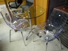 A modern glass & chrome table with two matching chairs