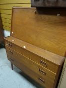 A mid-century teak bureau with three graduated base drawers Condition Report: please request via