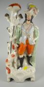 A nineteenth century Staffordshire spill-holder of huntsman with dog companion Condition Report: