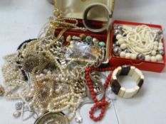 A tub of costume jewellery & beads Condition Report: please request via email. Condition reports not