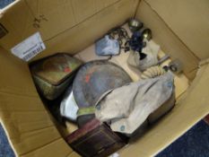 A parcel of twentieth century military items including ARP tin-hat, gas masks, old tins ETC