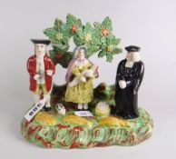 An early Staffordshire Walton-type pottery model of a preacher, two figures & a baby Condition