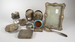 A pair of unusual pebble shaped embossed decorated silver spill holders, a silver & Guilloche enamel