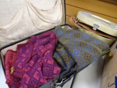 A vintage suitcase containing Welsh blanket waistcoats & a vanity case with contents Condition