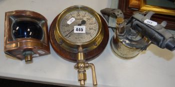 A maritime pressure gauge from an ocean tug 'Sea Alarm' together with a vintage blow-lamp & a