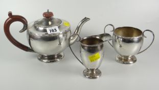 A three-piece silver tea service with bead decorated border, Birmingham 1969 / 1973, 24.7oz