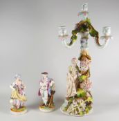A pair of continental figures & similar figural candlestick group (damage) Condition Report: