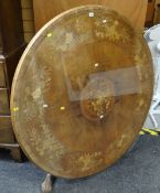 An antique circular marquetry-walnut breakfast-table complete with circular glass protector on an