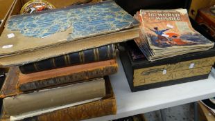 A vintage tin deed box with contents of the World of Wonder periodicals, a parcel of old books