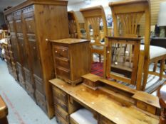 An extensive modern suite of stained-pine bedroom furniture Condition Report: please request via