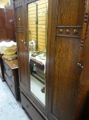 A vintage carved mirrored wardrobe with base drawer & matching four-drawer dressing table