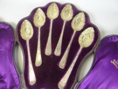 SET OF SIX CASED GEORGE III SILVER SPOONS engraved with scroll and foliate designs. Each spoon