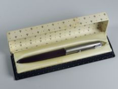 A VINTAGE BURGUNDY PARKER 51 FOUNTAIN PEN with lustraloy cap with chrome plated clip & jewel, in