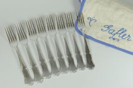 SET OF EIGHT NORWEGIAN SILVER FORKS of shell and scroll design. Hallmarked 