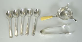 GROUP OF BRITISH SILVER FLATWARE to include tea strainer, sugar nips and set of five teaspoons.
