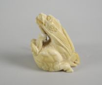 CHINESE CARVED IVORY NETSUKE STUDY OF A QILIN (MYTHOLOGICAL DRAGON BEAST) with signature to leg,