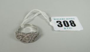 18K WHITE GOLD DIAMOND RING of interlocking leaf design made up of diamond chip and baguette cut