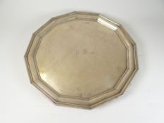 GEORGE V SILVER SALVER of dodecagon form raised on four feet, having engraved initials 