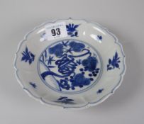 CHINESE PORCELAIN SMALL BLUE & WHITE SHALLOW DISH raised on circular foot, decorated with pine tree,