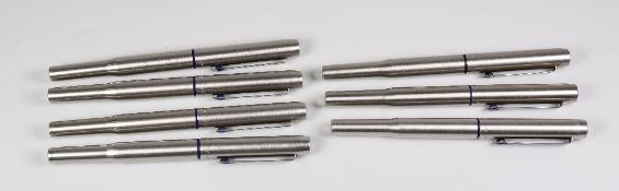 SEVEN VINTAGE STAINLESS STEEL PARKER 25 FOUNTAIN PENS with blue trim, 2 MK II (flat clip screw), 1