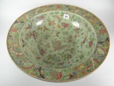 LARGE CHINESE PORCELAIN FAMILLE ROSE CELADON GROUND BOWL overall decorated with birds, butterflies
