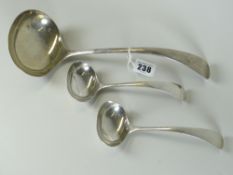 LARGE GEORGE V SILVER LADLE together with a pair of smaller silver ladles. All Sheffield 1924, W S