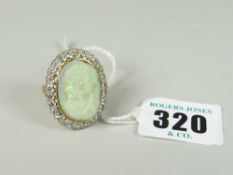 18CT GOLD LARGE CARVED OPAL & DIAMOND OVAL RING the carved opal depicting head & shoulders of a