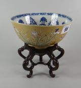 CHINESE PORCELAIN PEDESTAL BOWL the interior in blue & white design, the exterior in pale brown