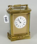 A GOOD BRASS ENCASED REPEATER CARRIAGE CLOCK striking on a gong, having a circular white dial