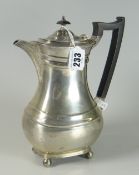 GEORGE V SILVER HOT WATER JUG/COFFEE POT of baluster form raised on four ball feet. Sheffield