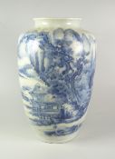CHINESE PORCELAIN BLUE & WHITE CYLINDRICAL VASE depicting pagodas, figures on a bridge in