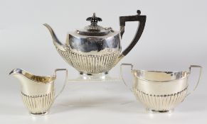 THREE PIECE SILVER TEA SET, comprising tea pot, sucrier and cream jug of half fluted oval form