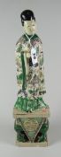 JAPANESE PORCELAIN FIGURE HOLDING SCEPTRE with flowing floral & inset decorated robes on symbolic