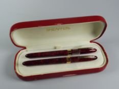 MODERN FLAME RED SHEAFFER CREST (REISSUE) FOUNTAIN PEN & ROLLERBALL SET in red laque finish in the