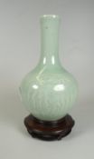 CHINESE CELADON GLAZED ONION SHAPED VASE depicting fantastical winged creature, unmarked, 18cms high