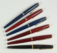 SIX VINTAGE PARKER 45 DELUXE FOUNTAIN PENS all with gold trim; one black, two blue & three red