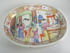 CHINESE EXPORT PORCELAIN FAMILLE ROSE OVAL SERVING DISH depicting figures in an interior scene